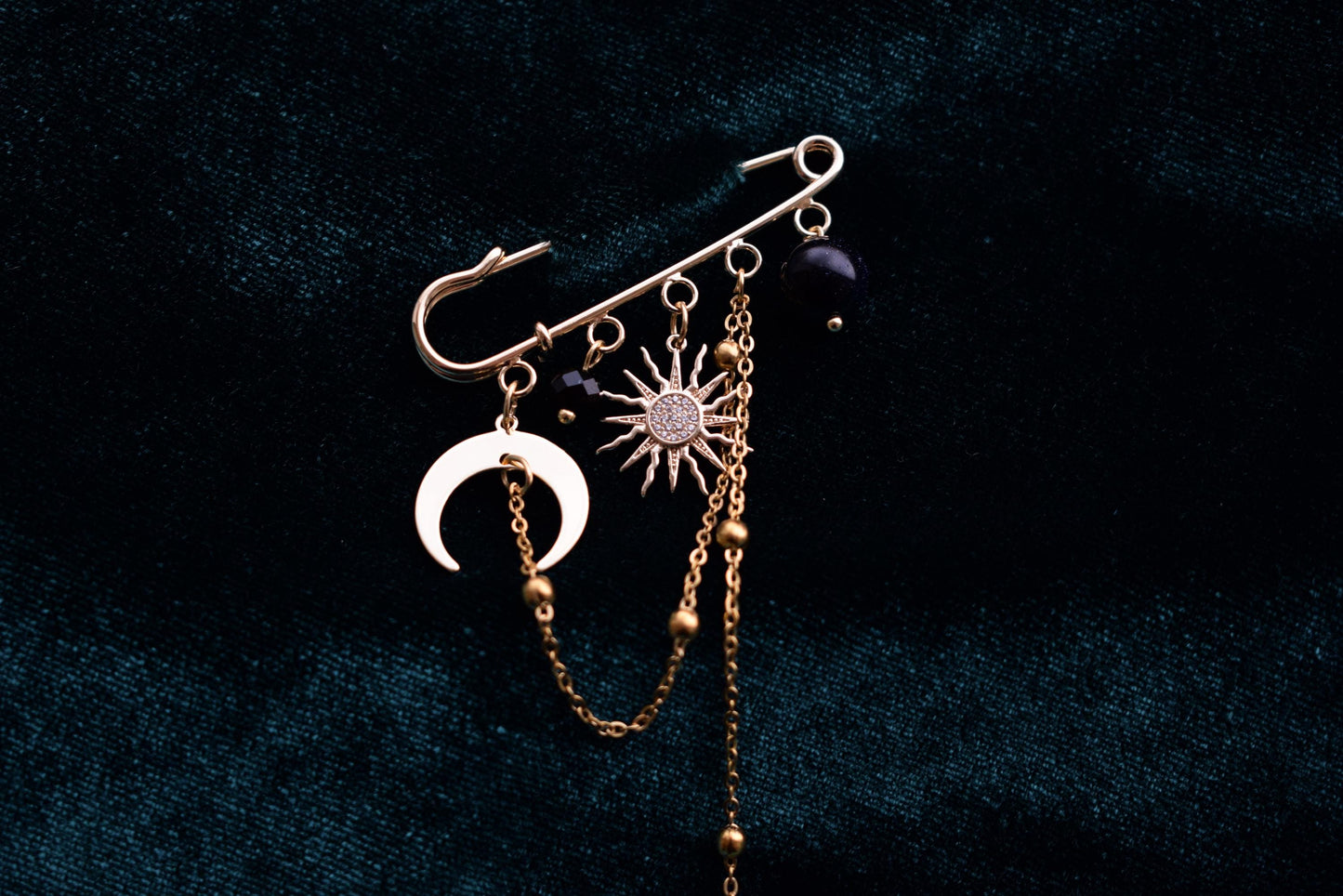 Handmade gold-tone pin inspired by the night sky