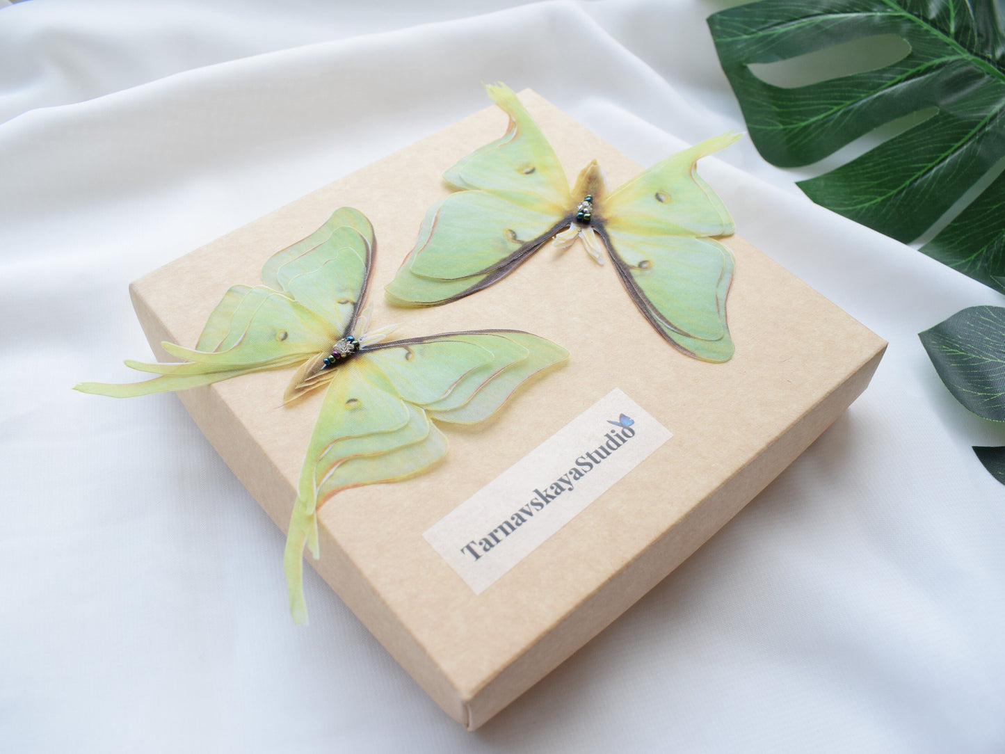 Nature-inspired olive moth hair clip handmade from silk organza with lightweight wings