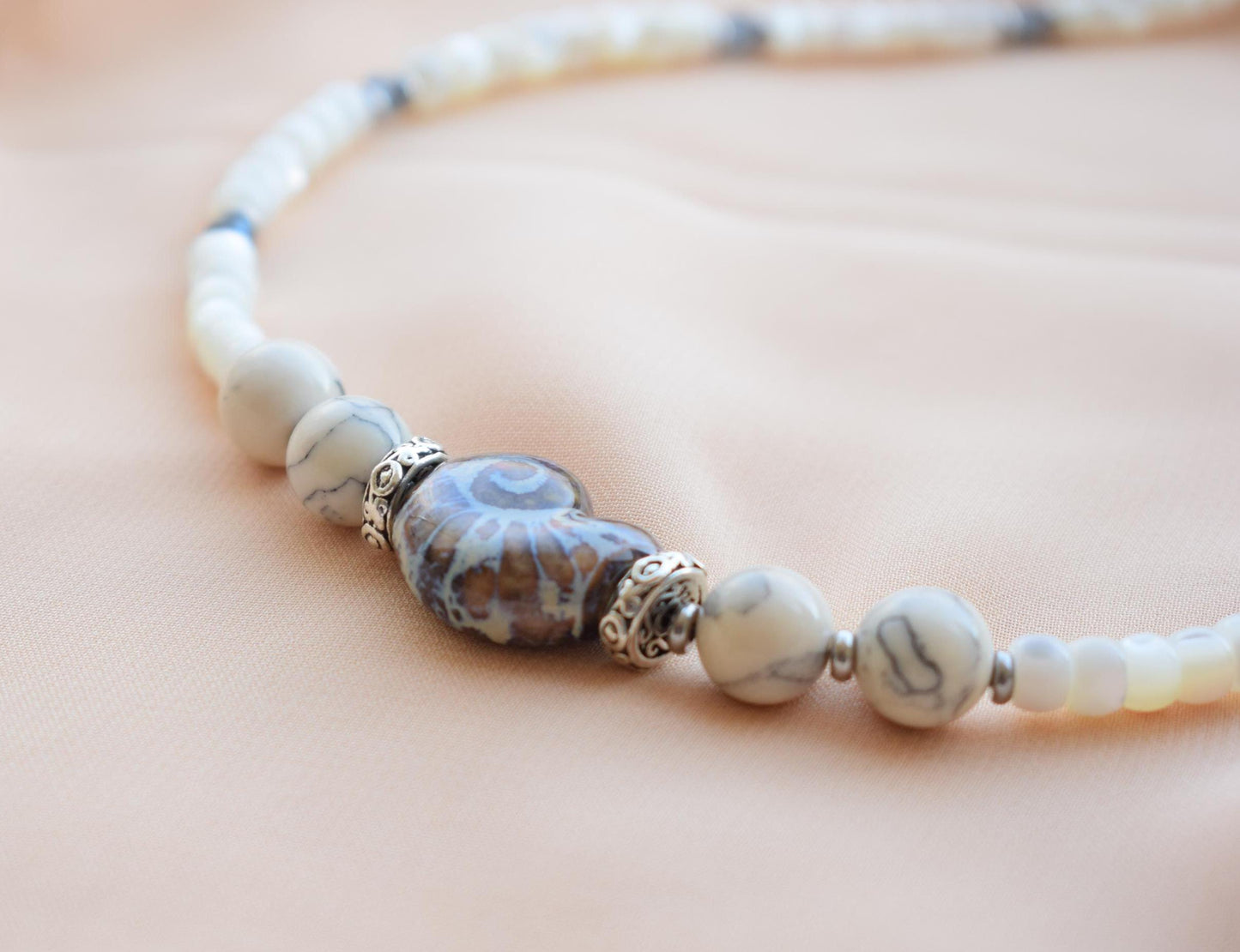 Close-up of ceramic beads and pearls in coastal-style jewelry