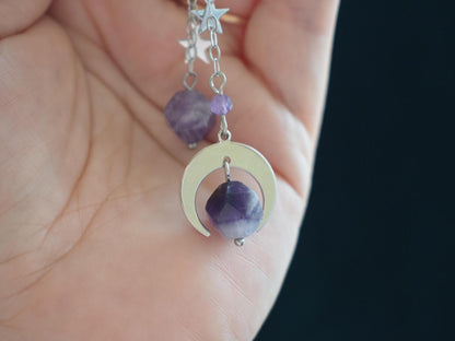 Close-up of celestial earrings with natural amethyst stones