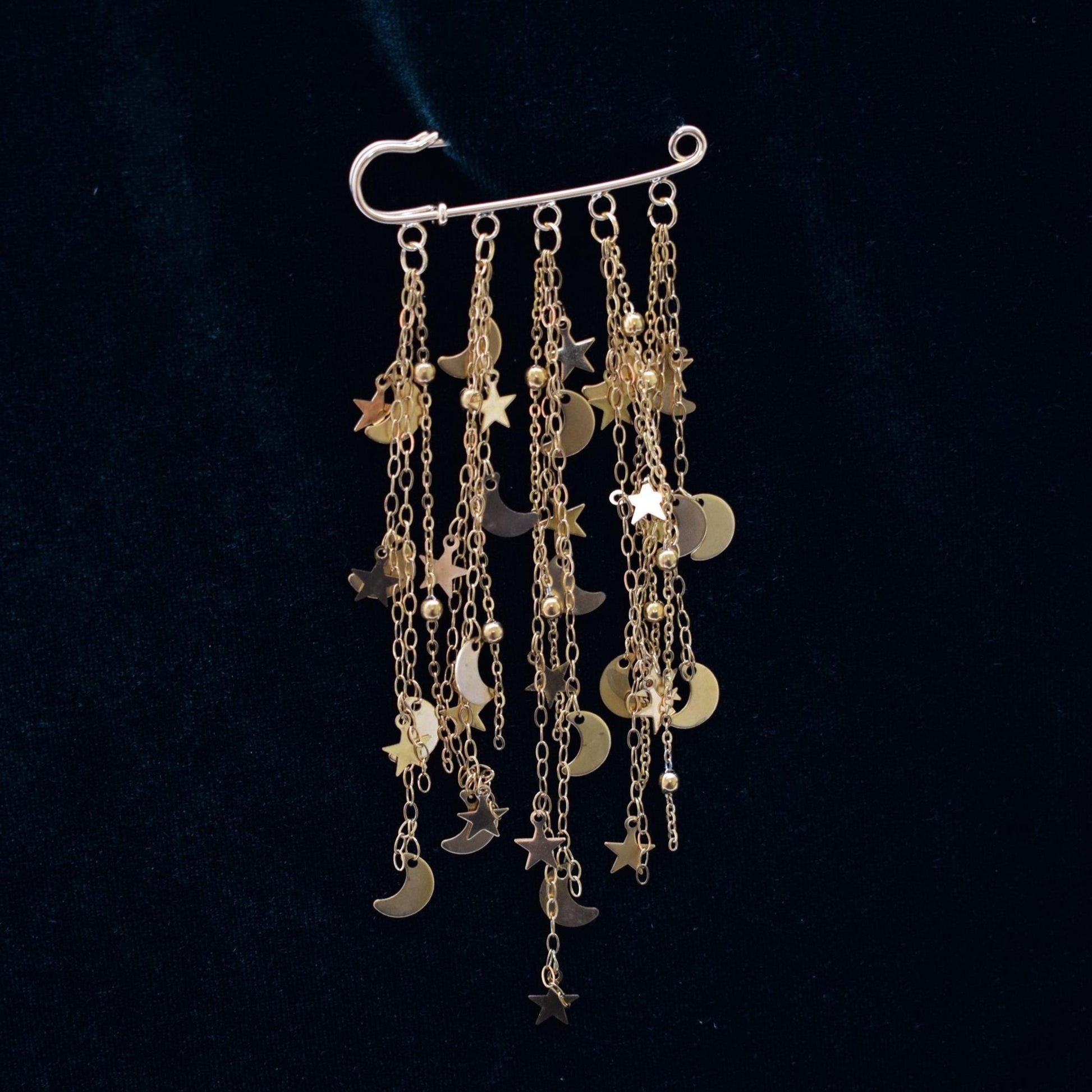 Gold chain brooch with tiny star and moon charms