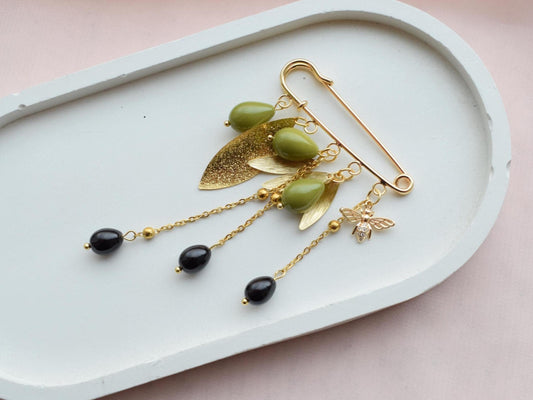 Olive branch brooch with gold leaves and bee charm