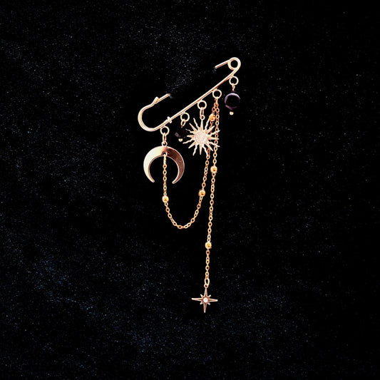 Gold celestial brooch with moon, star, and aventurine gemstone