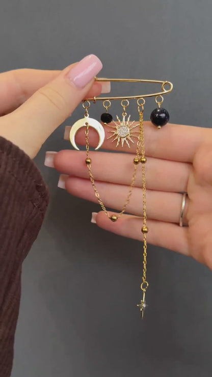 Gold celestial brooch with moon, star, and aventurine gemstone