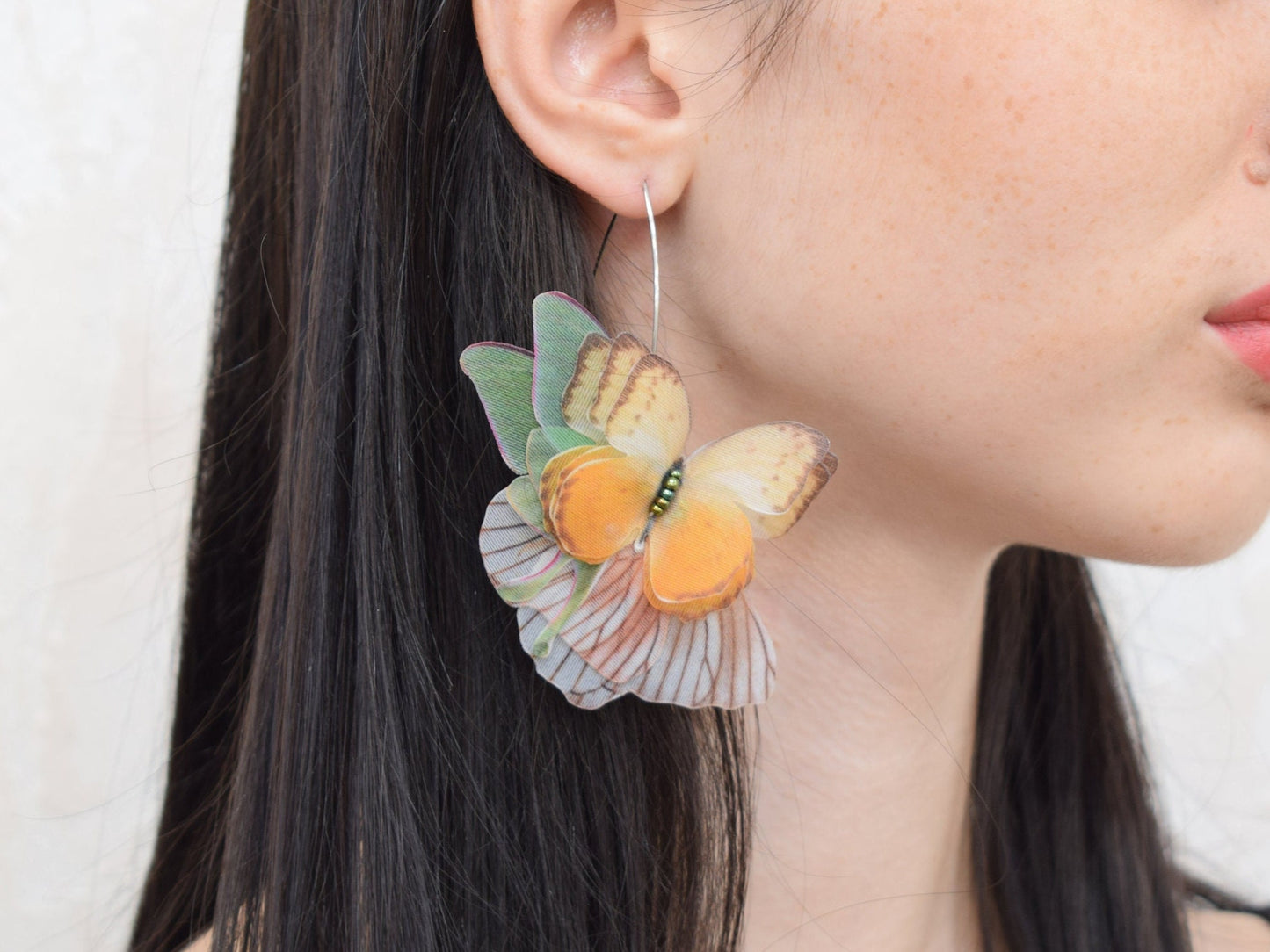 Silk orange butterflies moving wings drop earrings